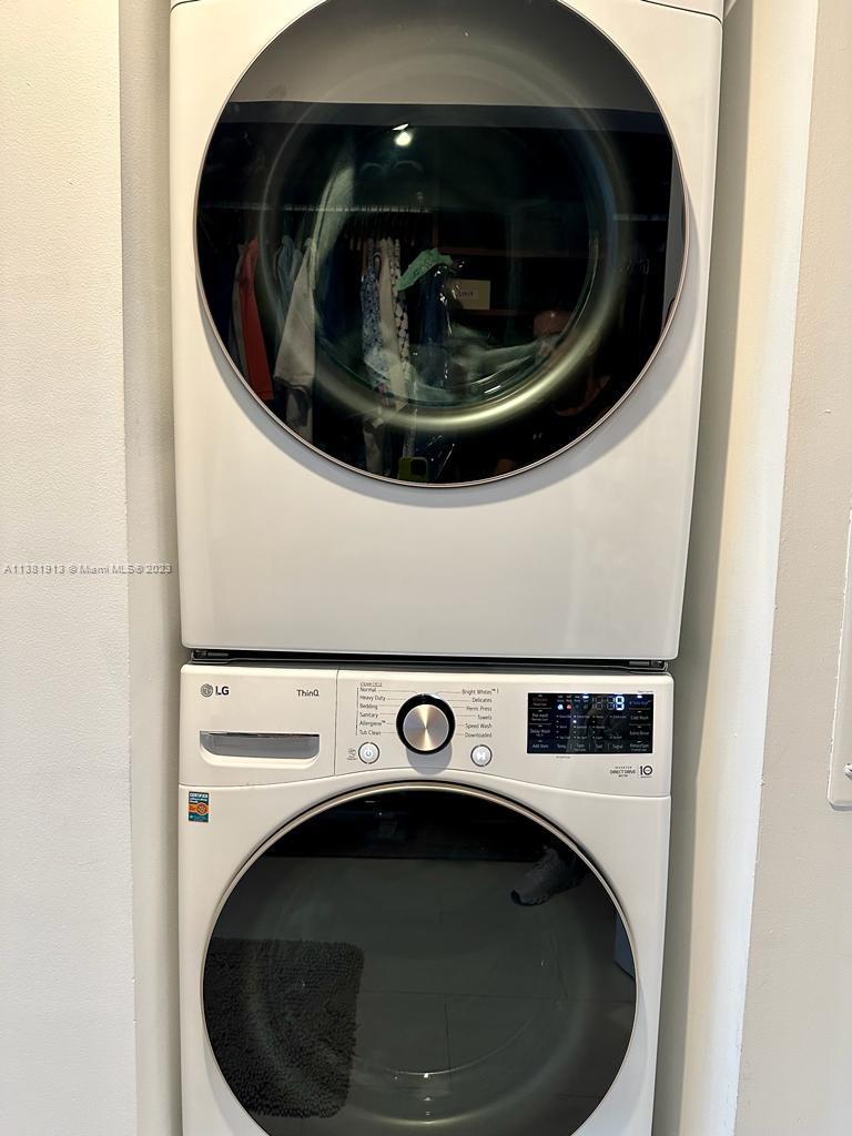 801 Brickell Key Boulevard, Unit 908 Miami, FL 33131 - Photo 17 of 29 a close up view of a washer and dryer