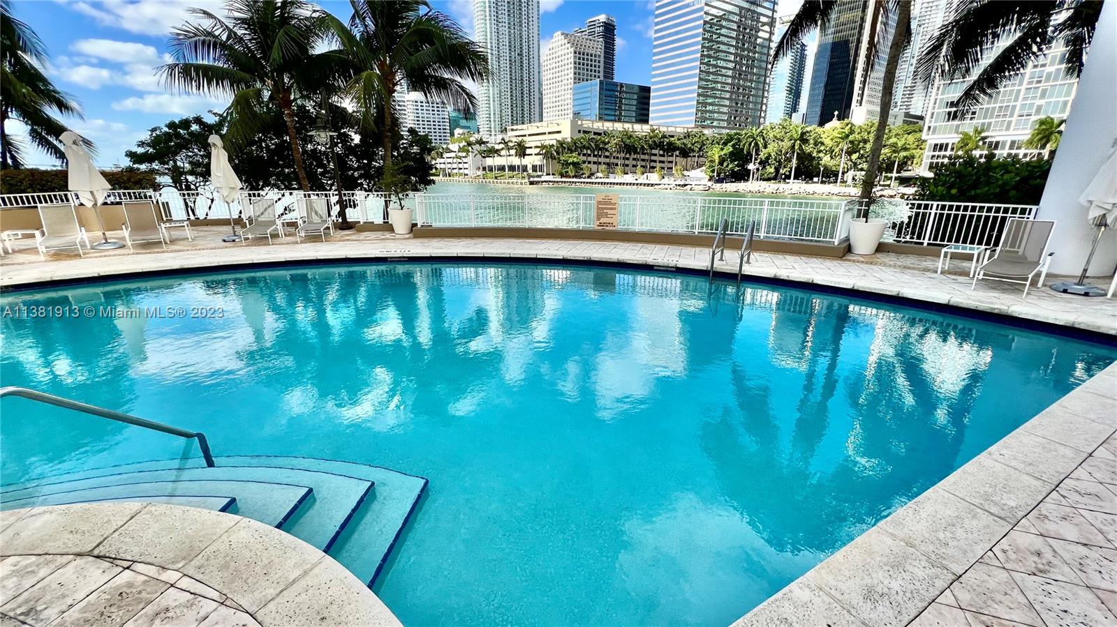 801 Brickell Key Boulevard, Unit 908 Miami, FL 33131 - Photo 21 of 29 a view of swimming pool with outdoor seating