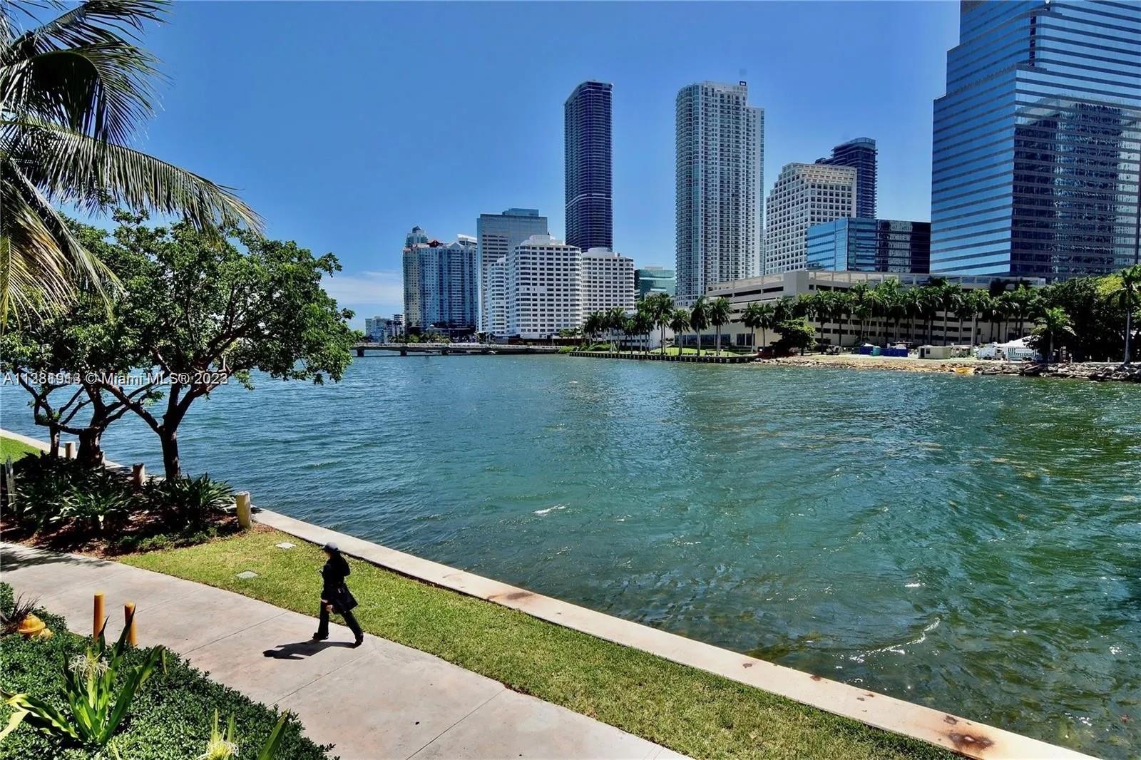 801 Brickell Key Boulevard, Unit 908 Miami, FL 33131 - Photo 22 of 29 a view of a lake with tall buildings