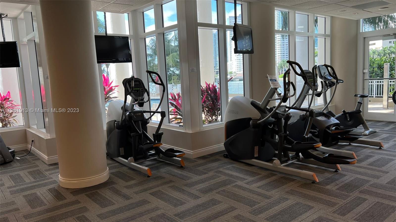 801 Brickell Key Boulevard, Unit 908 Miami, FL 33131 - Photo 26 of 29 a view of a room with gym equipment