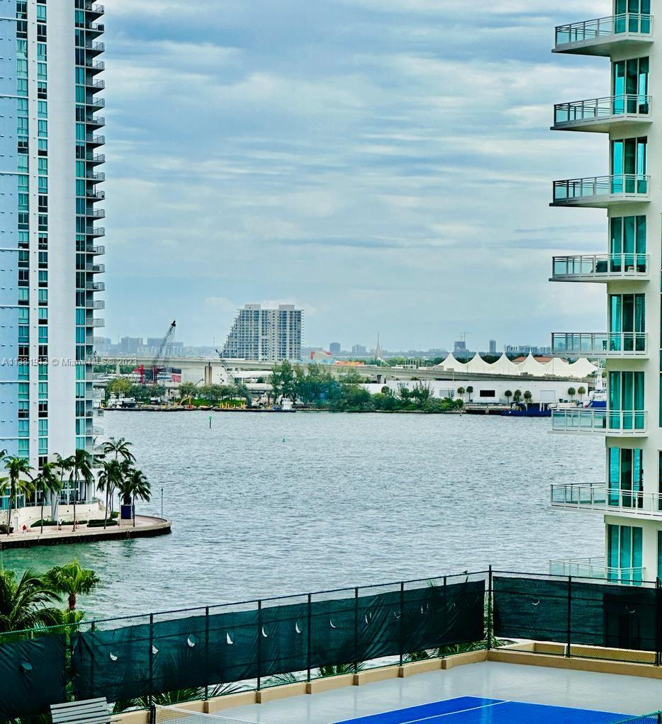 801 Brickell Key Boulevard, Unit 908 Miami, FL 33131 - Photo 3 of 29 a view of a lake with houses