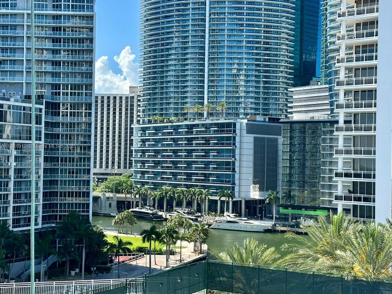 801 Brickell Key Boulevard, Unit 908 Miami, FL 33131 - Photo 4 of 29 a view of a house with a swimming pool