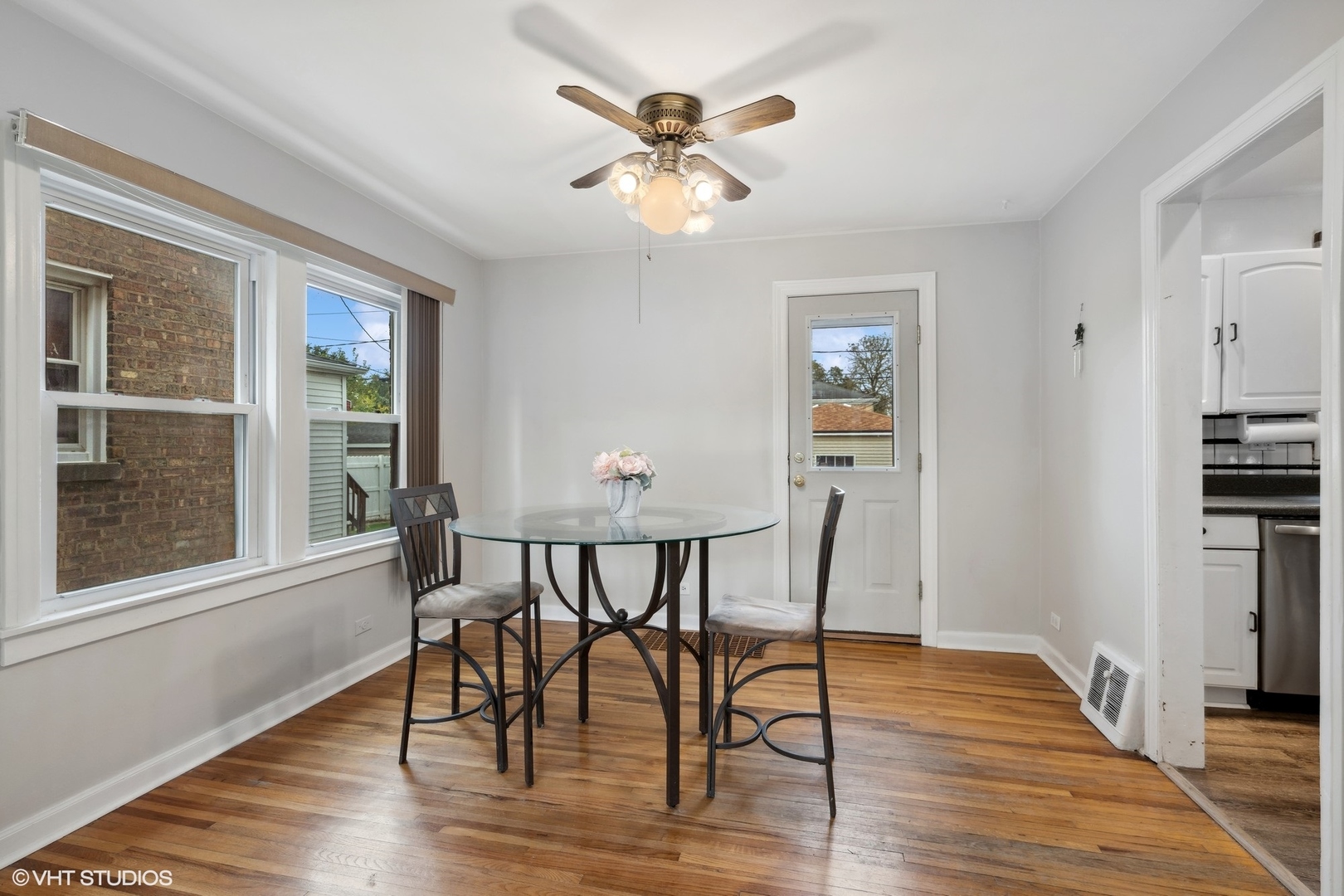 1437 Elgin Avenue Forest Park, IL 60130 - Photo 5 of 13 a view of a dining room with furniture wooden floor and a chandelier
