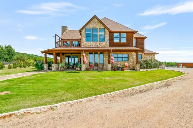 a front view of house with yard and green space