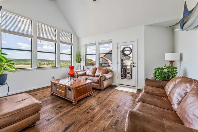 a living room with furniture fireplace and flat screen tv