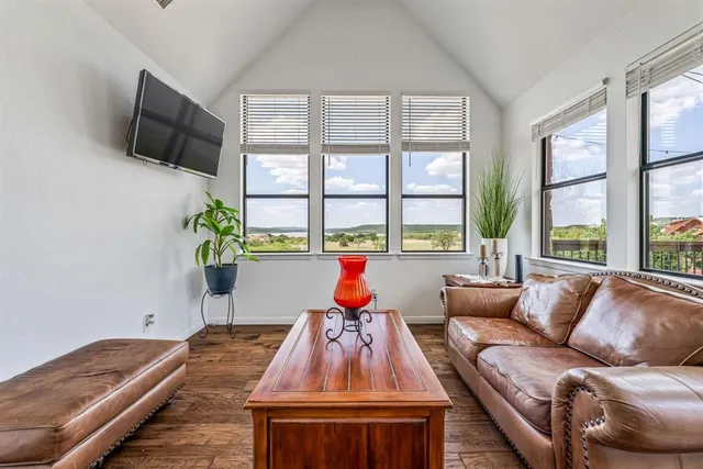a view of a patio with a table and chairs and potted plants