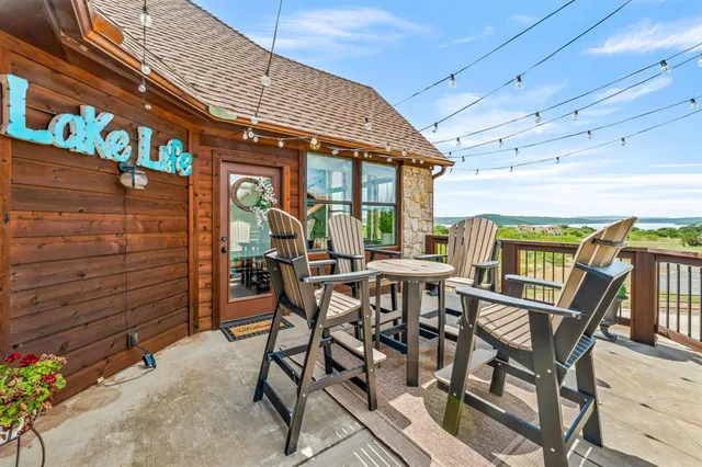 an aerial view of a house with swimming pool garden and patio