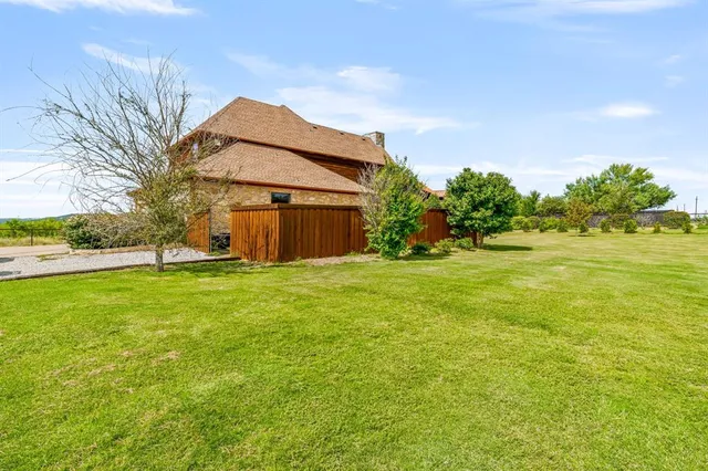 a view of a house with a big yard