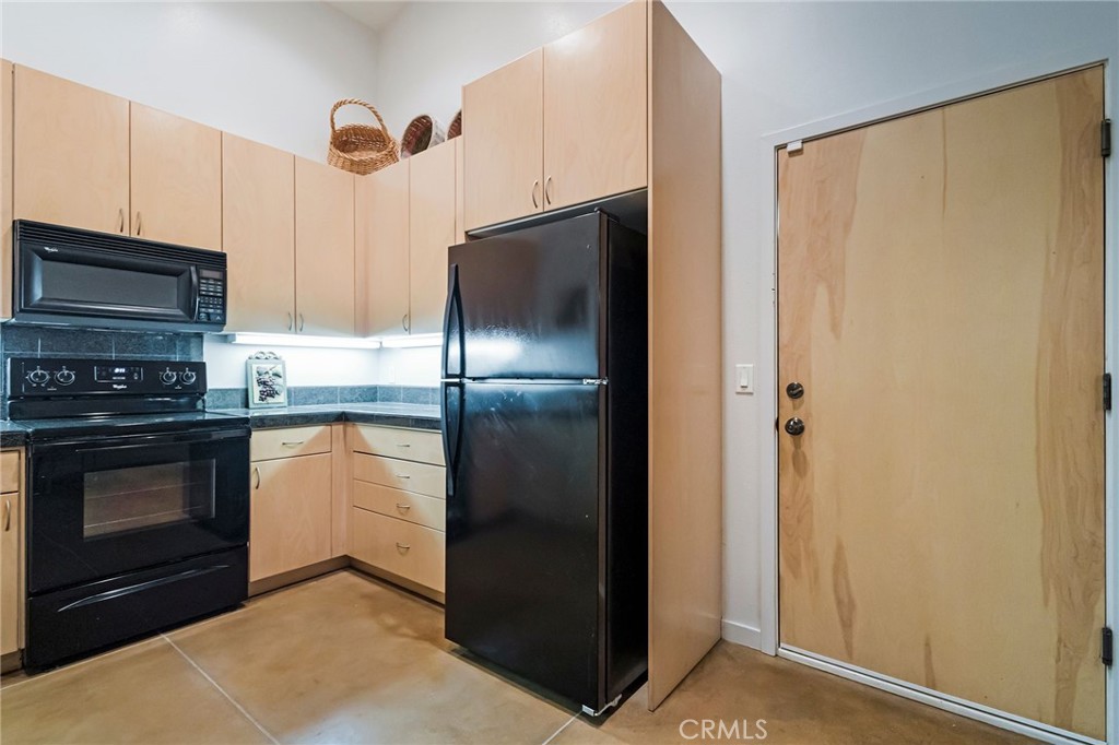 4911 Contentment Lane Forest Ranch, CA 95942 - Photo 13 of 30 a kitchen with stainless steel appliances granite countertop a refrigerator and a stove top oven