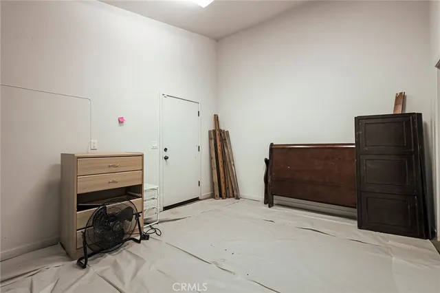 a bedroom with a bed and cabinets