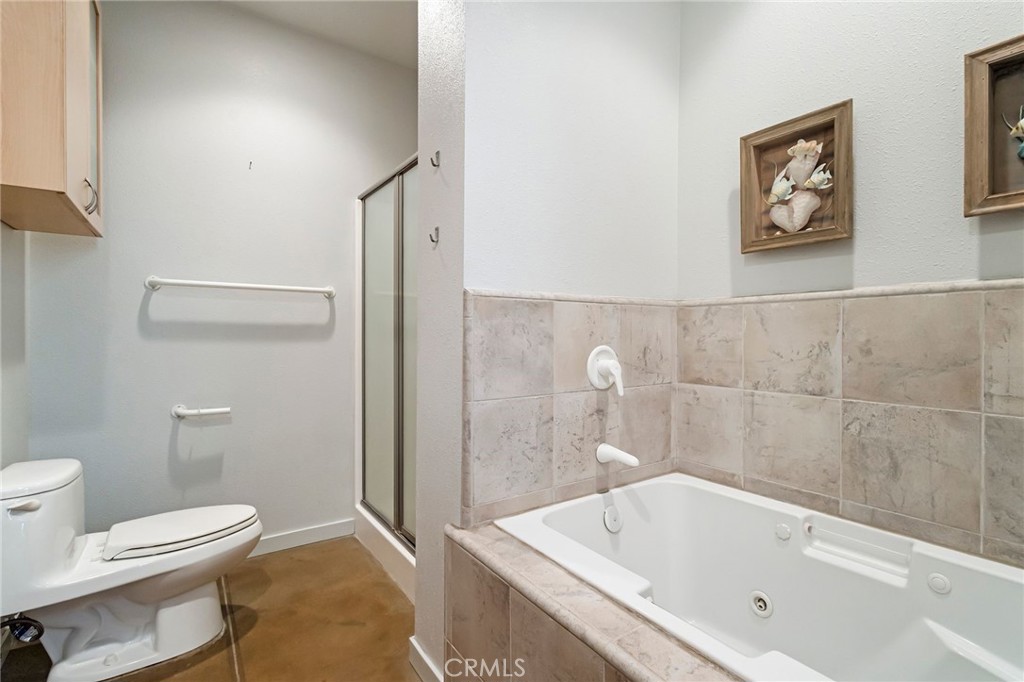 4911 Contentment Lane Forest Ranch, CA 95942 - Photo 25 of 30 a bathroom with a tub toilet and sink