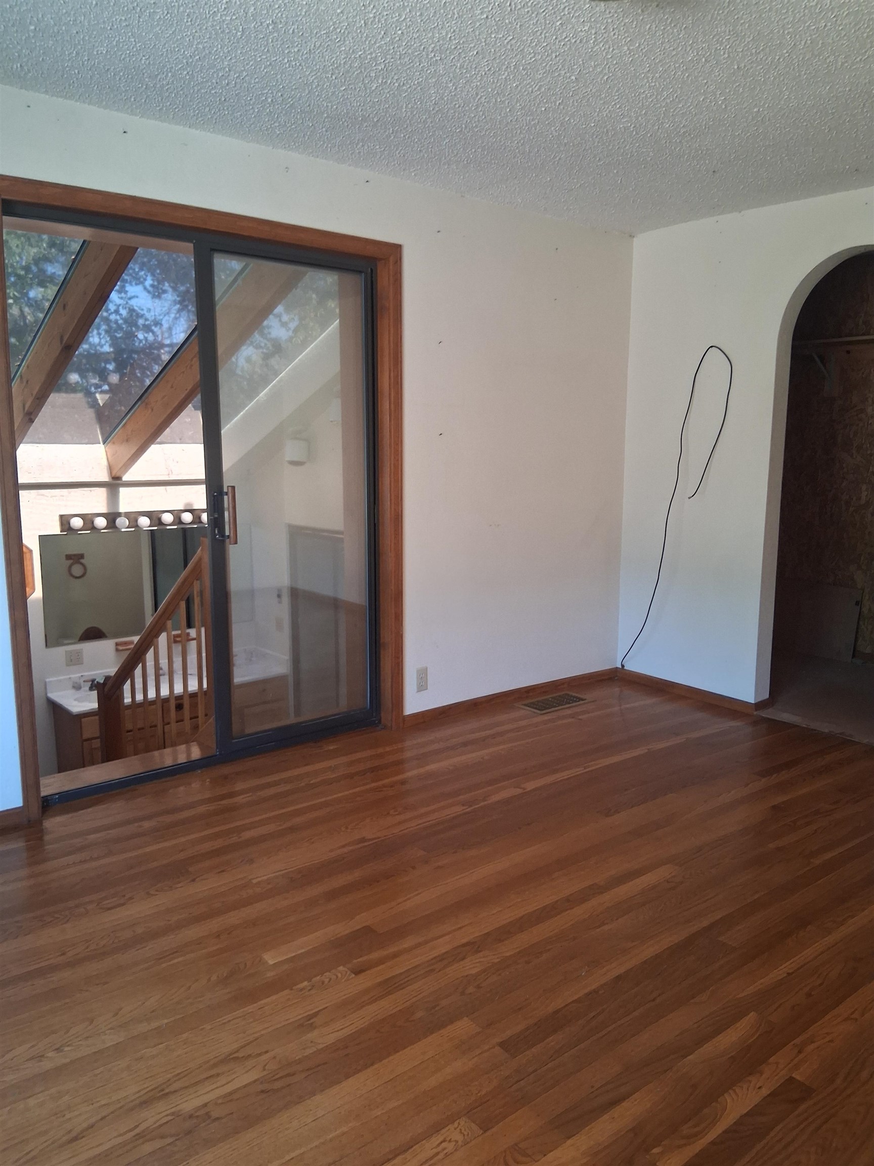 1983 River Road Fruita, CO 81521 - Photo 20 of 31 a view of an empty room with wooden floor and a window
