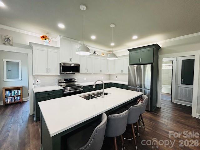 278 Right Prong Road Ellenboro, NC 28040 - Photo 13 of 47 a kitchen with stainless steel appliances a table chairs and wooden floor