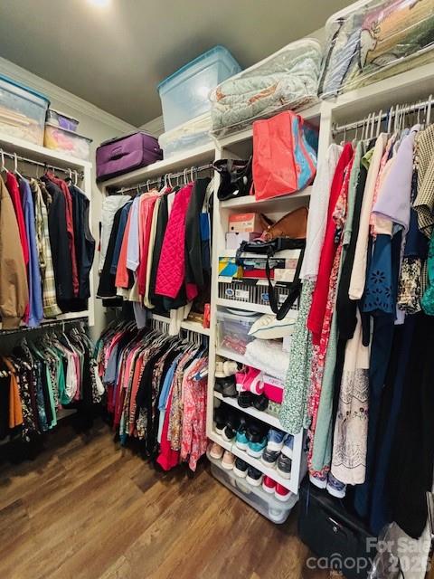 278 Right Prong Road Ellenboro, NC 28040 - Photo 22 of 47 a view of walk in closet with clothes and shoes