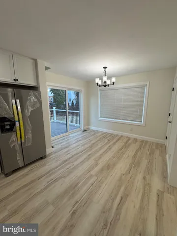 a view of a livingroom with wooden floor