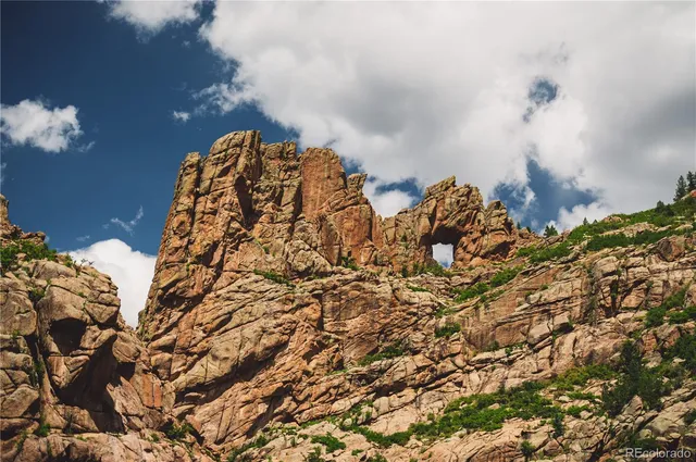 a view of a house with a mountain in the background