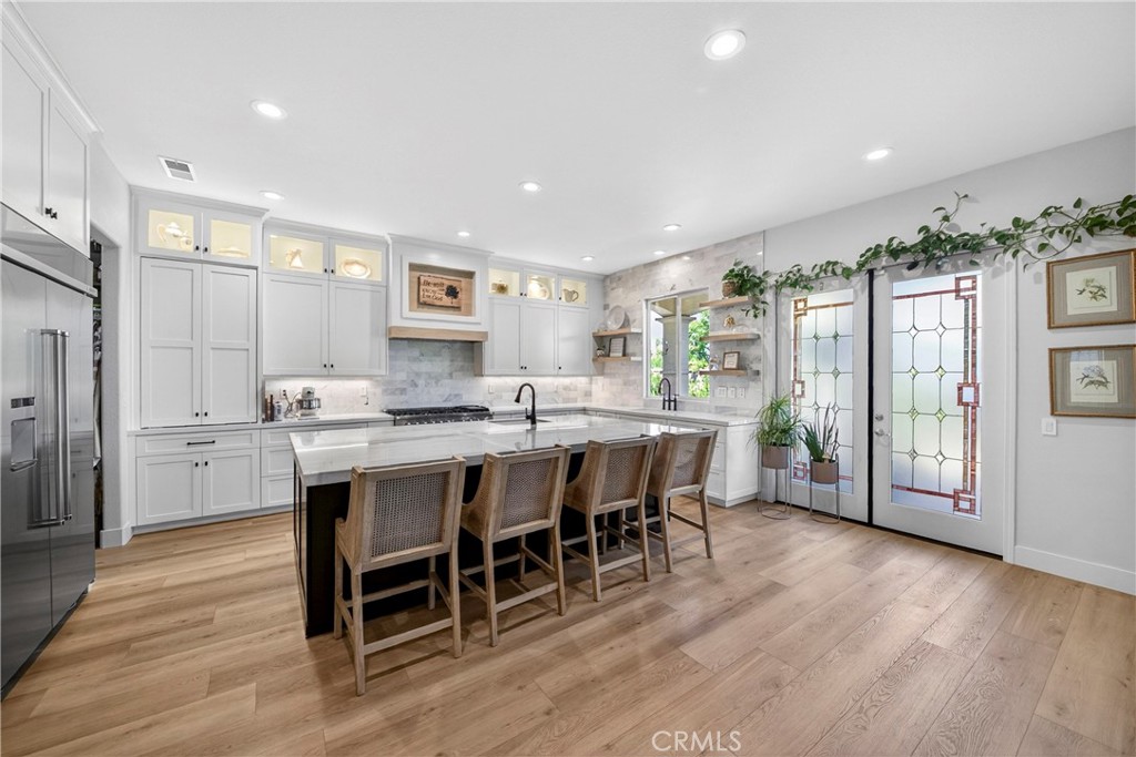 16375 Ory Circle Riverside, CA 92503 - Photo 14 of 51 a dining hall with stainless steel appliances granite countertop a dining table chairs and granite counter tops