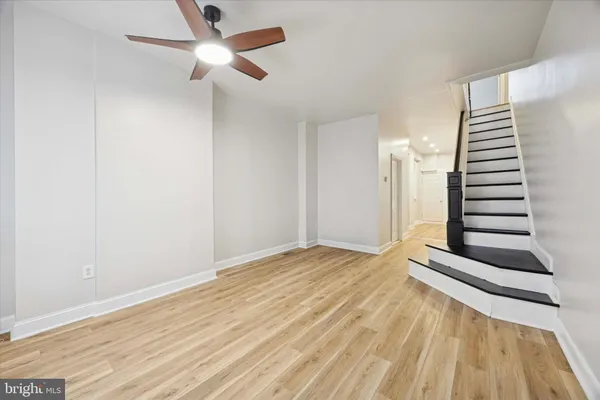 a view of wooden floor and windows in a room