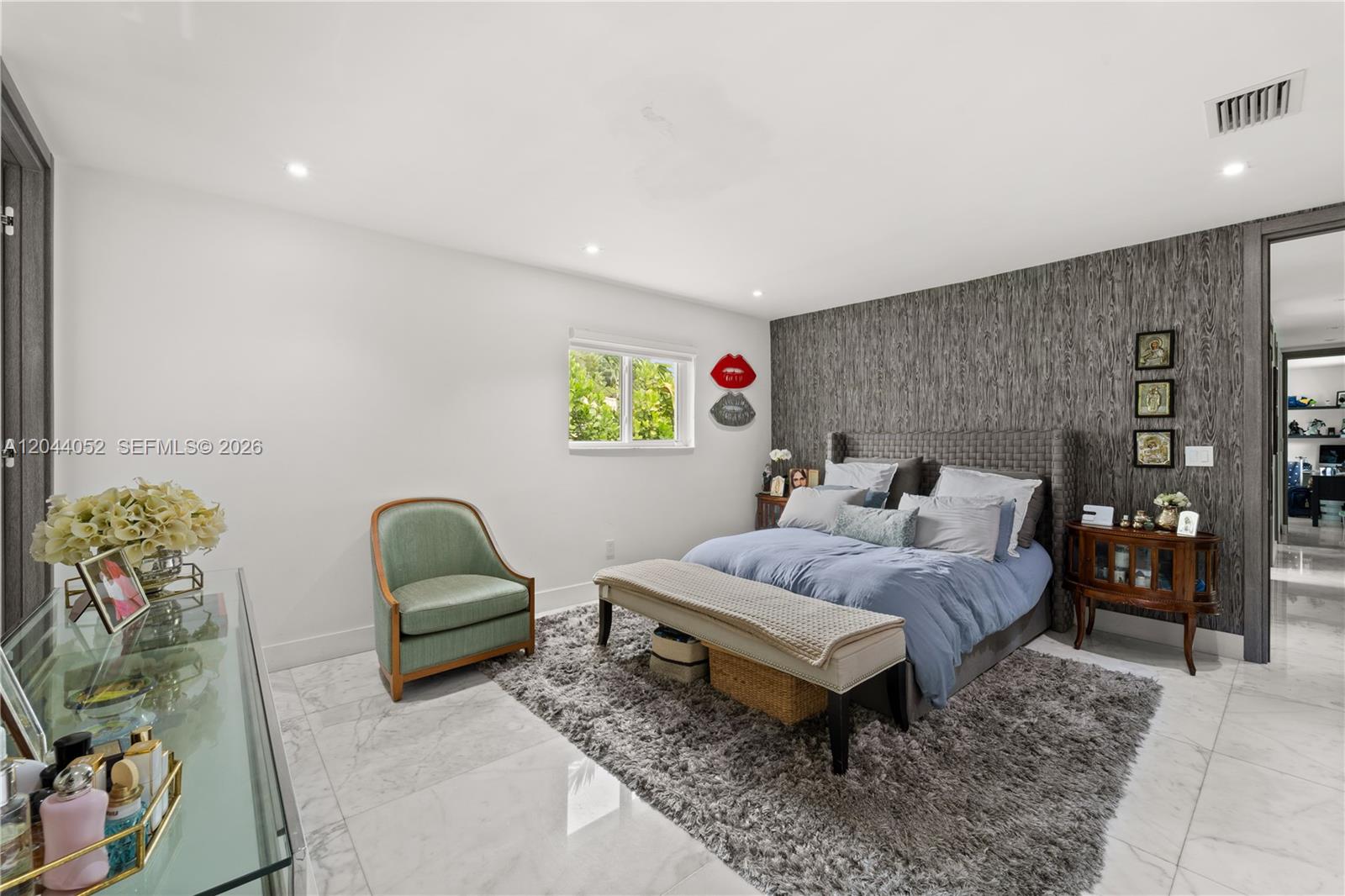 721 Bird Road Coral Gables, FL 33146 - Photo 15 of 24 a spacious bedroom with a bed and a couch
