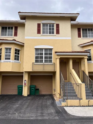 a front view of a house with a garage
