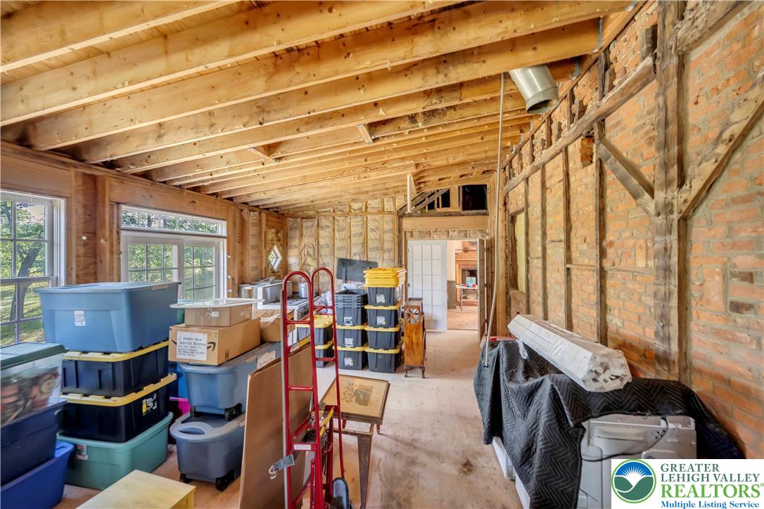 384 Henry Road Nazareth, PA 18064 - Photo 34 of 54 Exposed wooden ceiling joists and brick framing define this rustic, unfinished space.