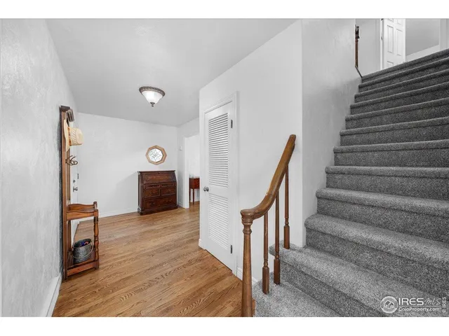 a bedroom with two beds and view of living room
