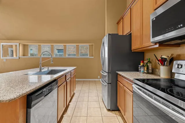 a kitchen with granite countertop a sink and a granite counter tops