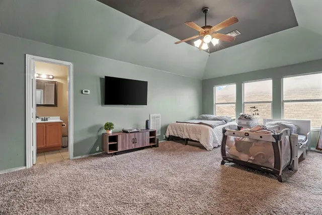a view of an empty room with furniture and wooden floor