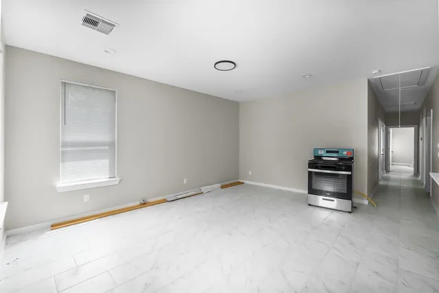 a view of an empty room with a window