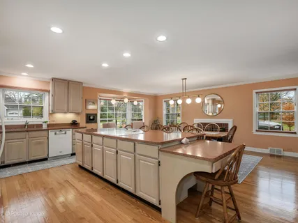a kitchen with sink stove and cabinets
