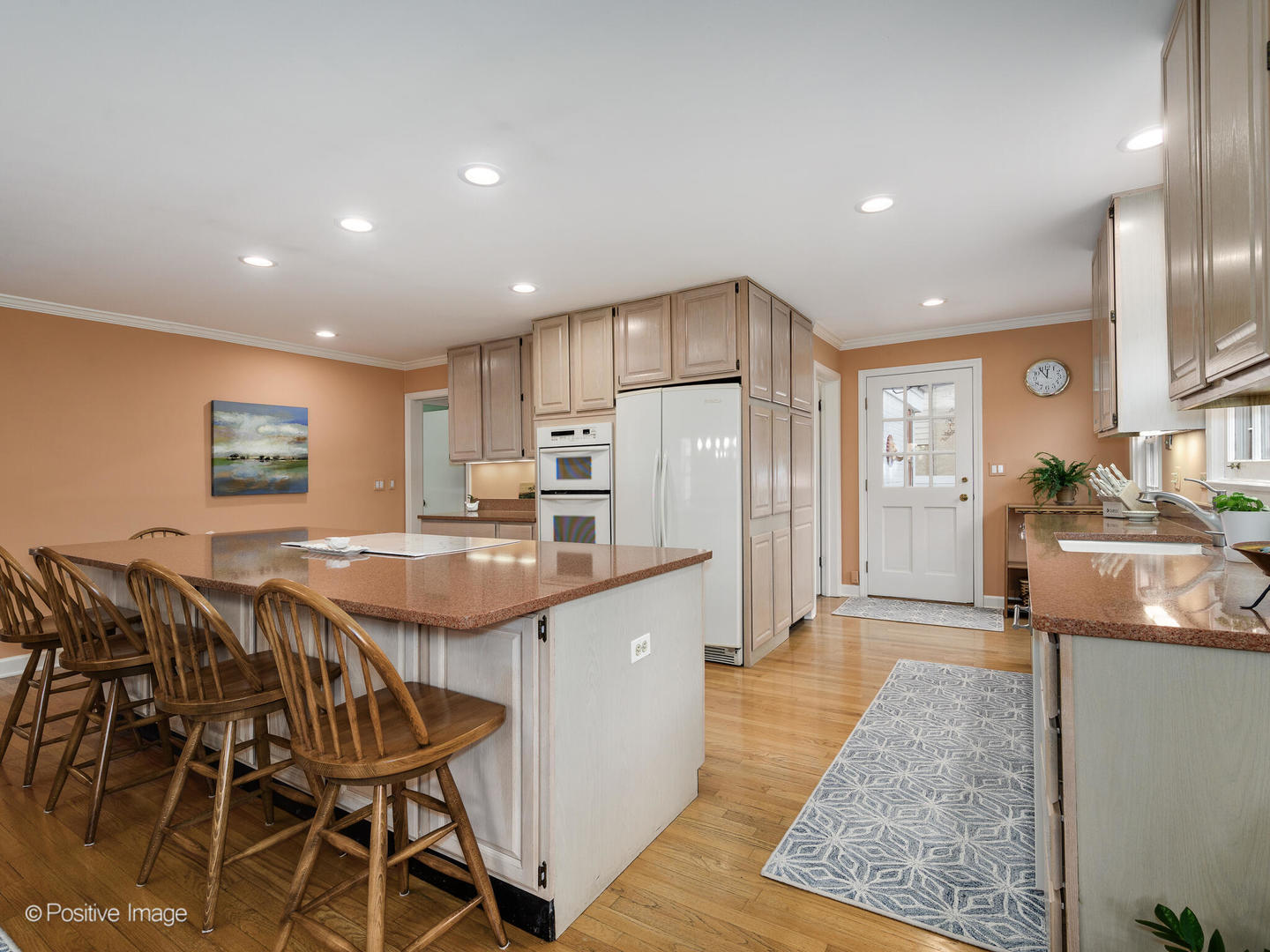 1520 Longvalley Road Glenview, IL 60025 - Photo 15 of 35 a kitchen with stainless steel appliances granite countertop table chairs sink and wooden floor