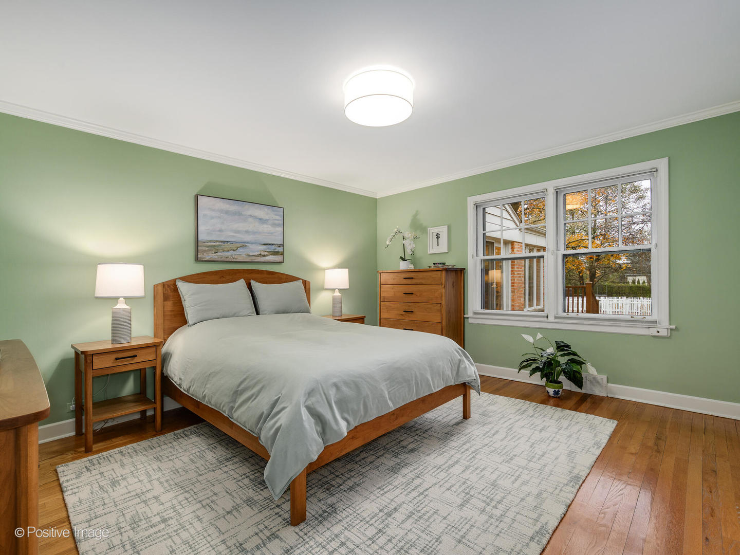 1520 Longvalley Road Glenview, IL 60025 - Photo 16 of 35 a bedroom with a bed lamps and wooden floor