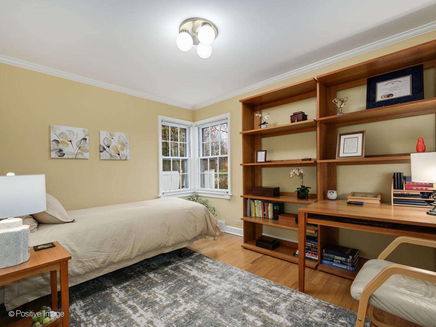 1520 Longvalley Road Glenview, IL 60025 - Photo 19 of 35 a bedroom with a bed and a bookshelf