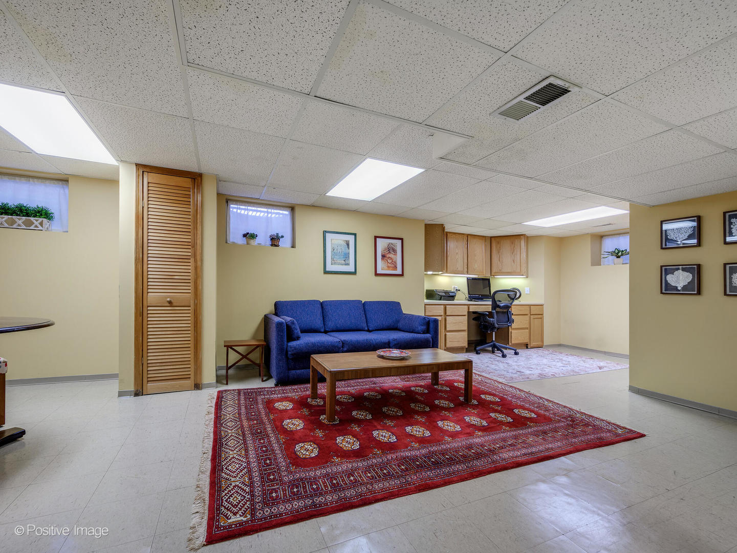 1520 Longvalley Road Glenview, IL 60025 - Photo 24 of 35 a living room with furniture a rug and gym equipment