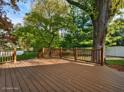a view of deck with wooden floor and fence
