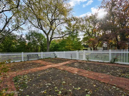 a view of a backyard with fence