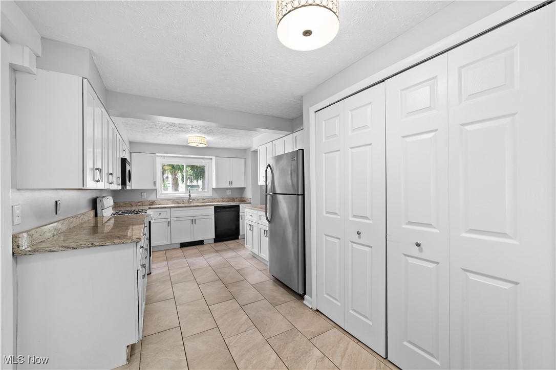 4920 Marigold Road Mentor, OH 44060 - Photo 21 of 34 Updated kitchen with granite counters, updated cabinets, ceramic flooring and appliances.