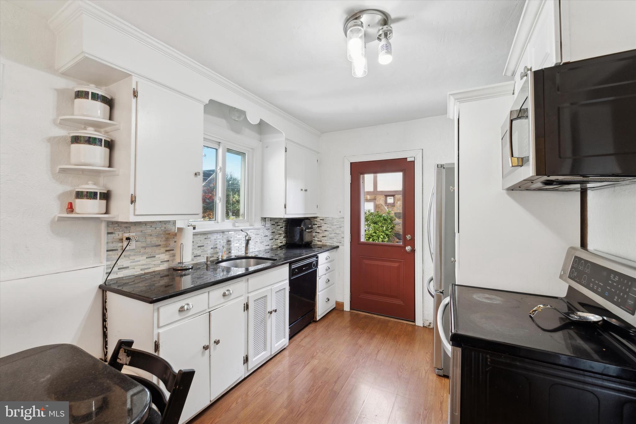 559 Broadview Road Upper Darby, PA 19082 - Photo 4 of 16 a kitchen with a sink appliances and cabinets
