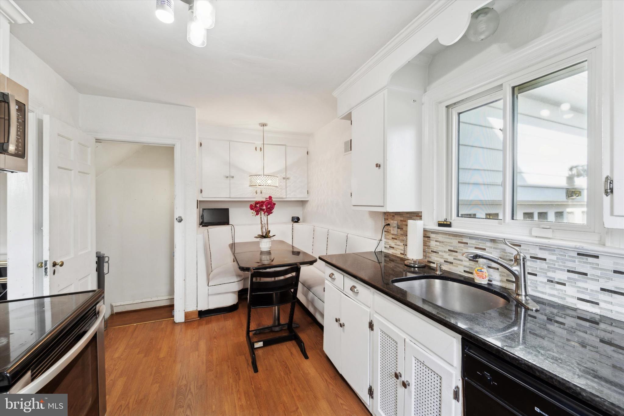 559 Broadview Road Upper Darby, PA 19082 - Photo 5 of 16 a kitchen that has a sink cabinets counter space and a window