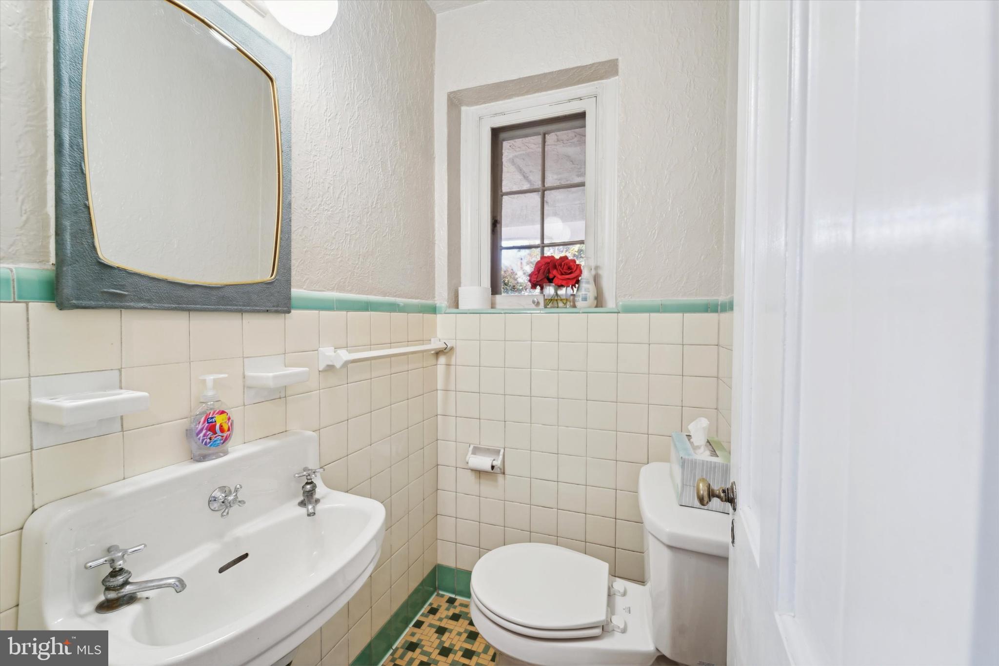 559 Broadview Road Upper Darby, PA 19082 - Photo 6 of 16 a bathroom with a sink and a mirror