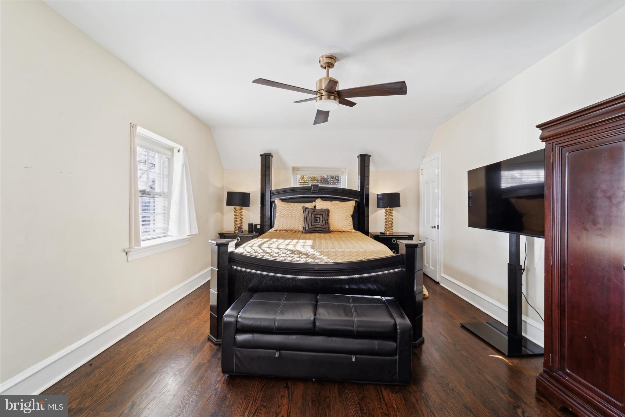 559 Broadview Road Upper Darby, PA 19082 - Photo 7 of 16 a bedroom with a bed and wooden floor