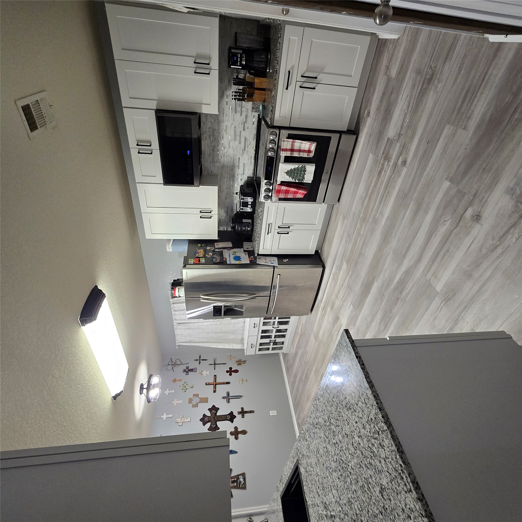 212 Druse Lane Jarrell, TX 76537 - Photo 13 of 39 a kitchen with stainless steel appliances granite countertop a sink stove and refrigerator