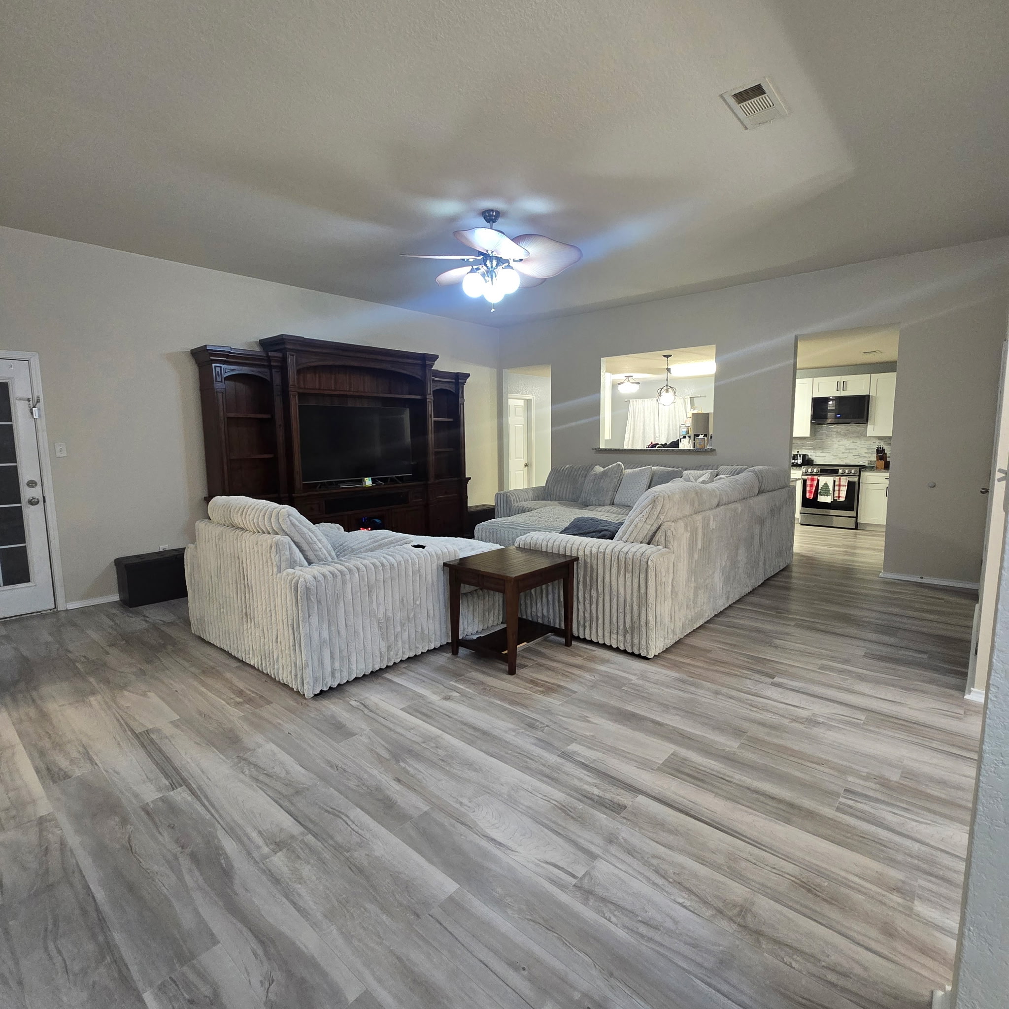 212 Druse Lane Jarrell, TX 76537 - Photo 18 of 39 a living room with furniture and a ceiling fan