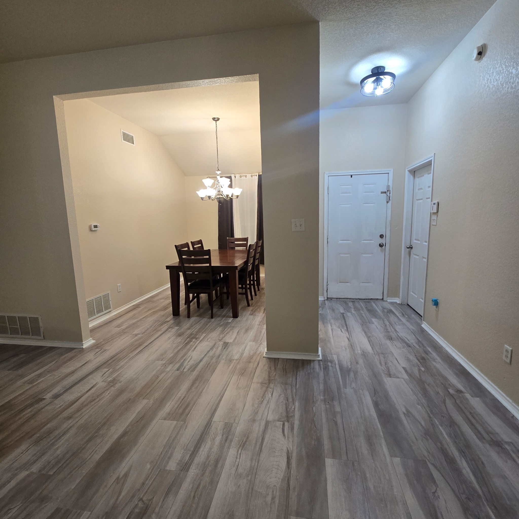 212 Druse Lane Jarrell, TX 76537 - Photo 19 of 39 a view of a room with wooden floor a fireplace