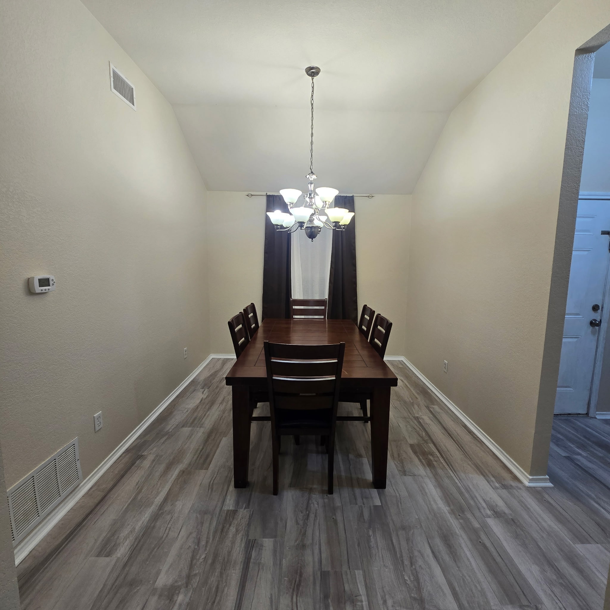 212 Druse Lane Jarrell, TX 76537 - Photo 20 of 39 a view of a room with furniture wooden floor and a chandelier
