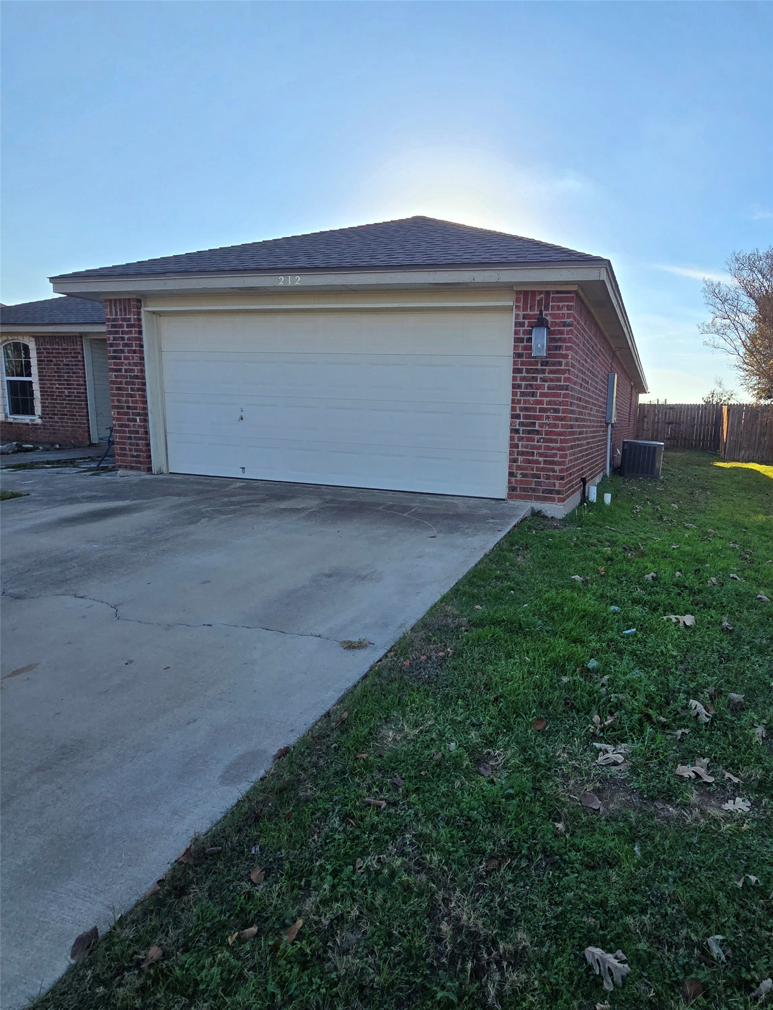 212 Druse Lane Jarrell, TX 76537 - Photo 2 of 39 a front view of a house with a yard and garage
