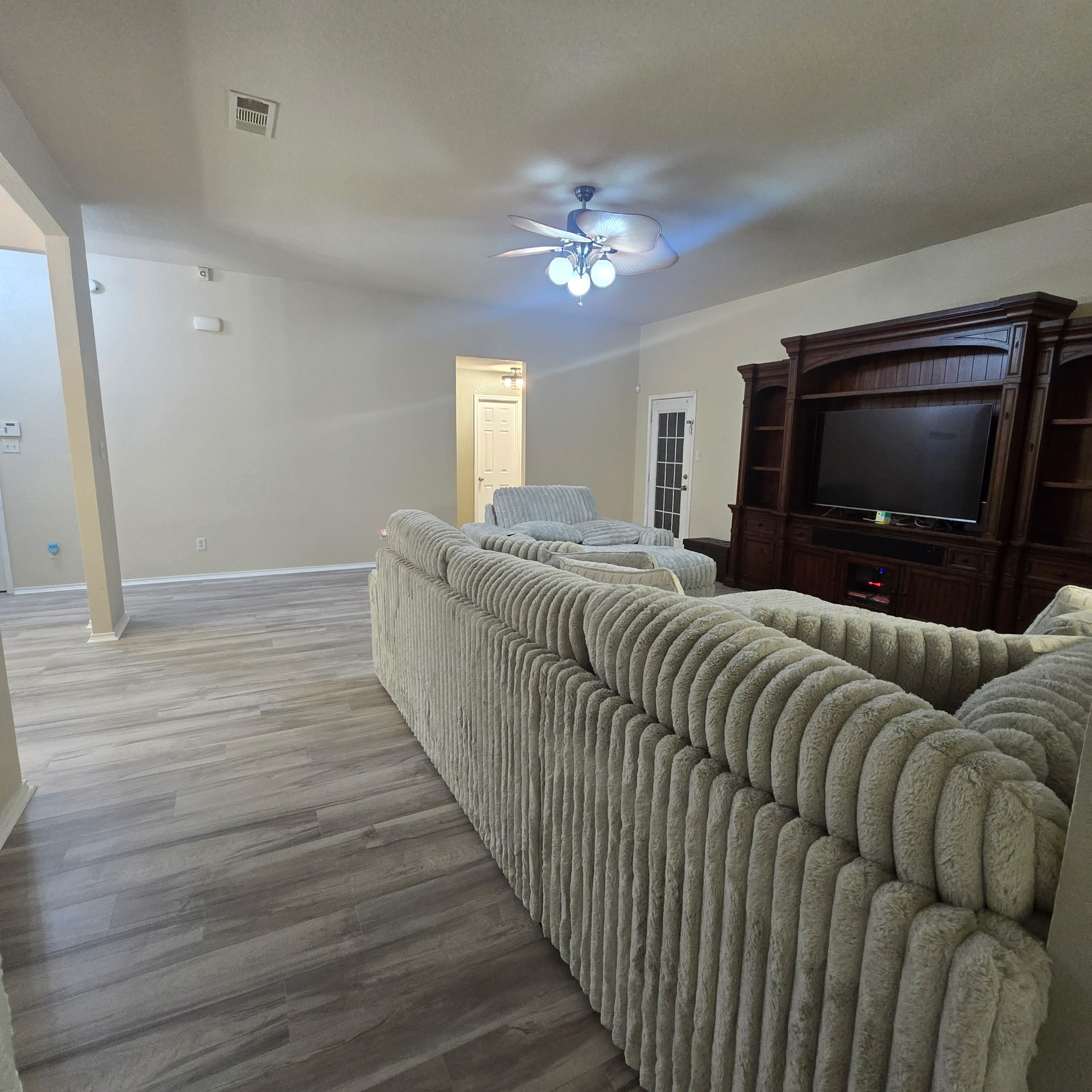 212 Druse Lane Jarrell, TX 76537 - Photo 25 of 39 a living room with furniture and a flat screen tv