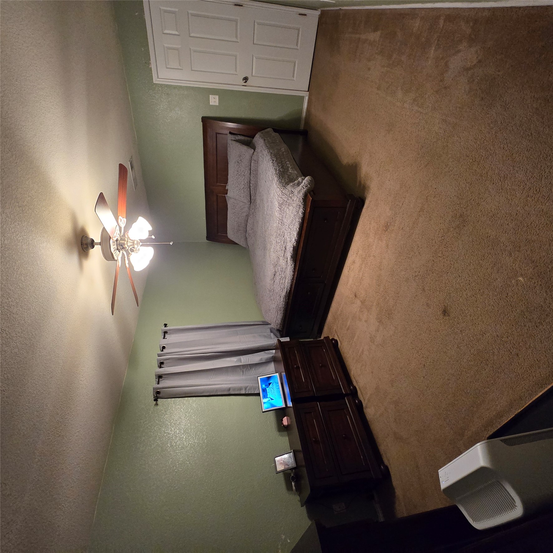 212 Druse Lane Jarrell, TX 76537 - Photo 29 of 39 a bedroom with a bed and a chandelier