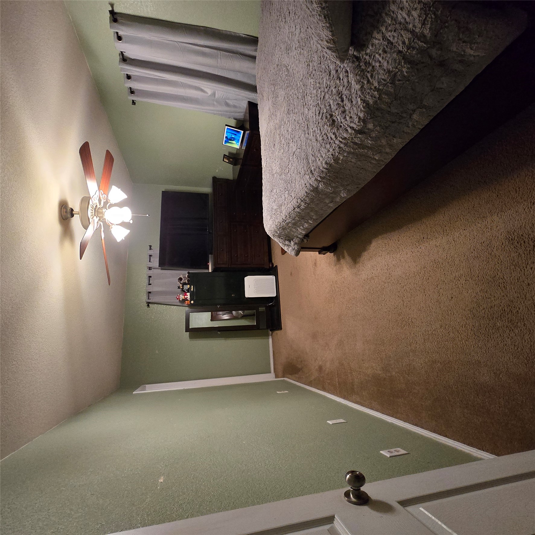 212 Druse Lane Jarrell, TX 76537 - Photo 30 of 39 a spacious bedroom with a bed and a television