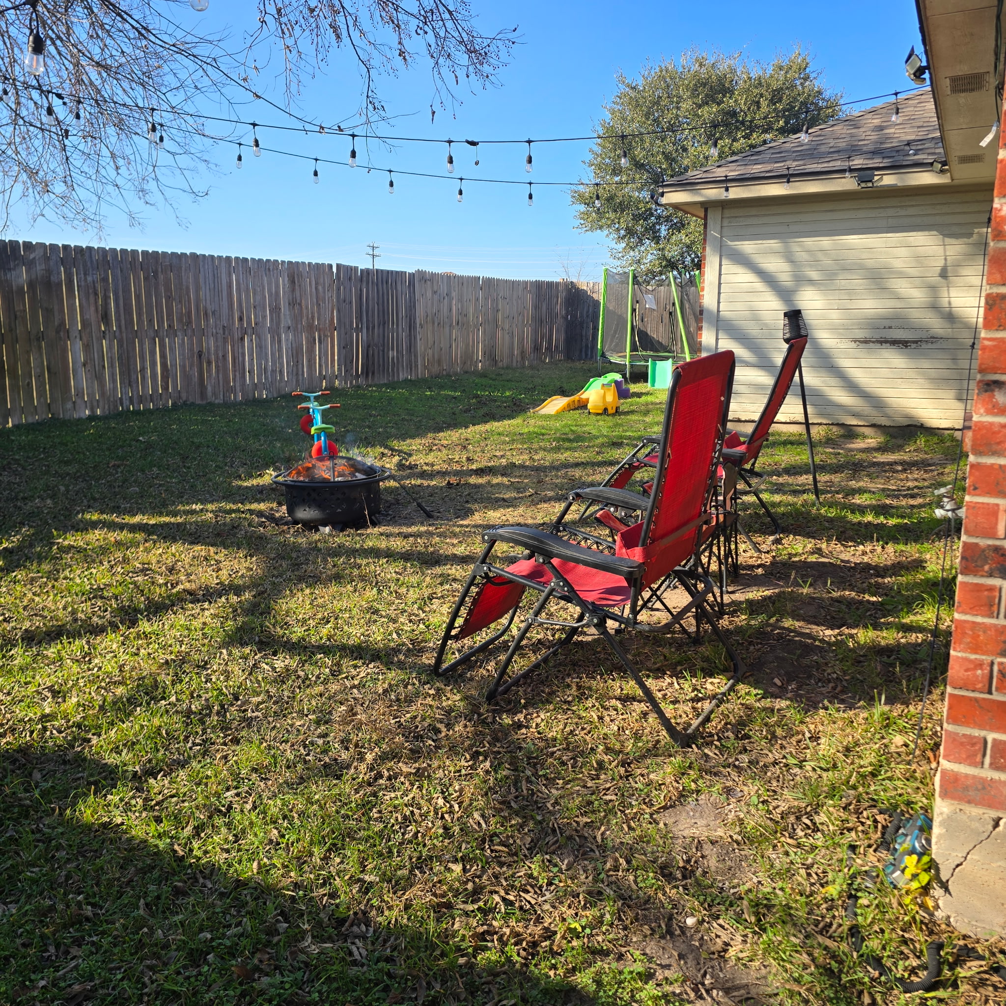 212 Druse Lane Jarrell, TX 76537 - Photo 38 of 39 a view of a backyard with table and chairs